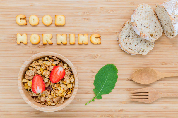 Good morning concept - Cereal in wooden bowl with strawberry and - Фото, изображение