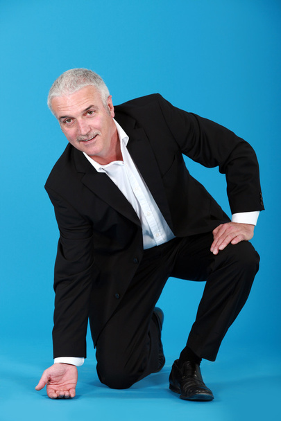 Businessman touching the floor - Photo, Image