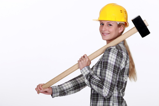 Tradeswoman carrying a mallet - Photo, Image
