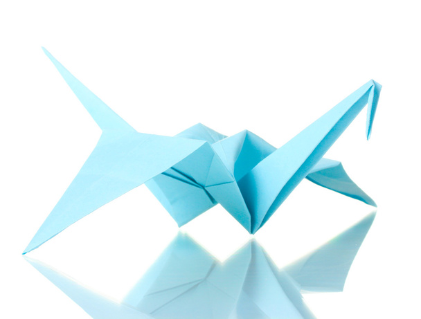 Origami crane out of the blue paper isolated on white - Fotó, kép