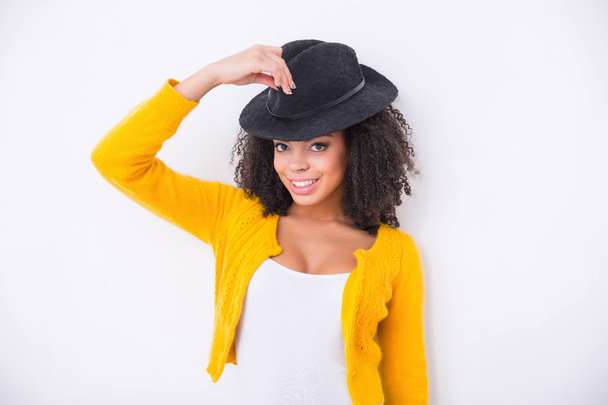 Nice mulatto woman  wearing black hat - Photo, Image
