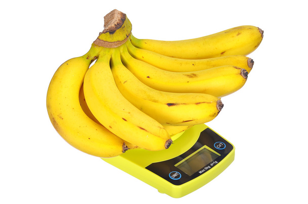 Концепция питания диета: связка бананов на электронной кухне с
 - Фото, изображение