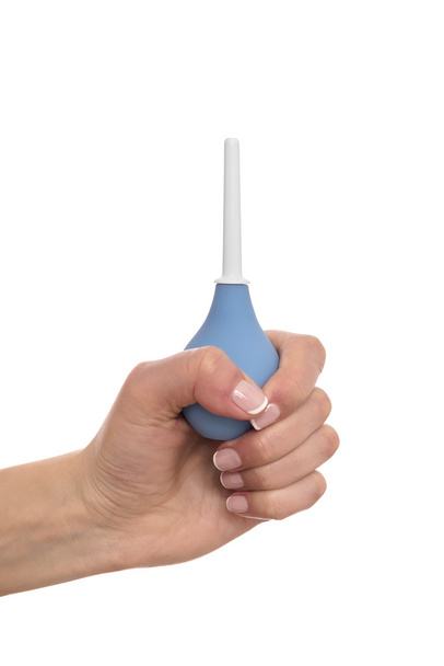 Enema in a hand on white background. - Photo, image