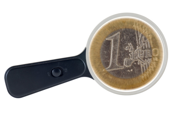 Euro coin under magnifying glass. Economic speculation. Clipping path. - Photo, Image