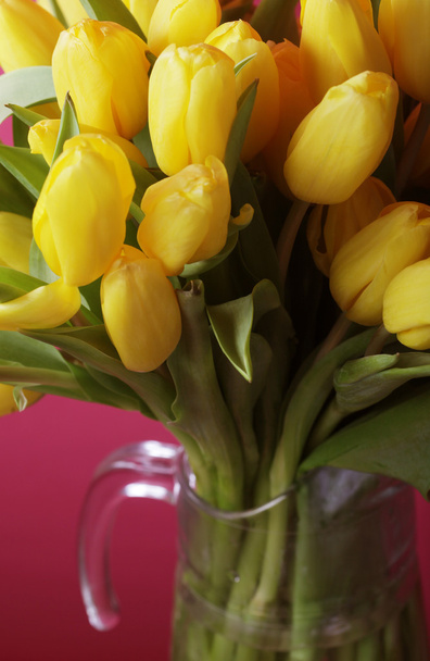 yellow tulip flowers in glass vase - Foto, Imagen