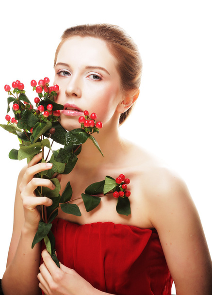 beautiful woman with red flowers - Fotoğraf, Görsel