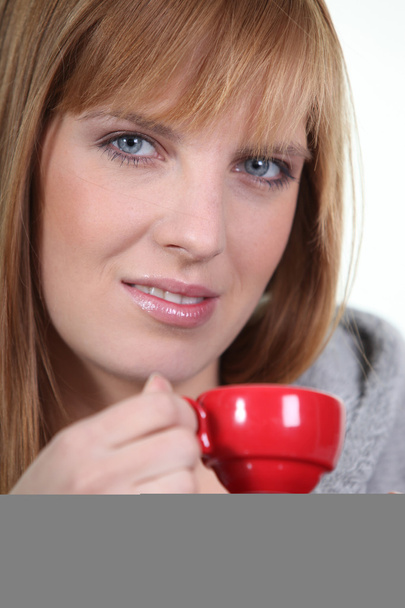 Woman with red coffee cup - Photo, image