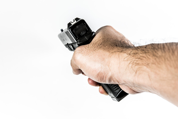 Schusswaffe in der Hand  - Foto, Bild