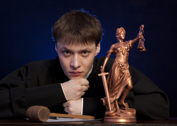 Male judge in a courtroom striking the gavel - Φωτογραφία, εικόνα