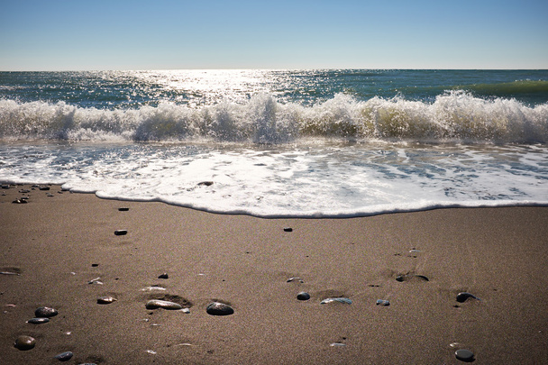 Waves wash over dark sand - Foto, Imagem
