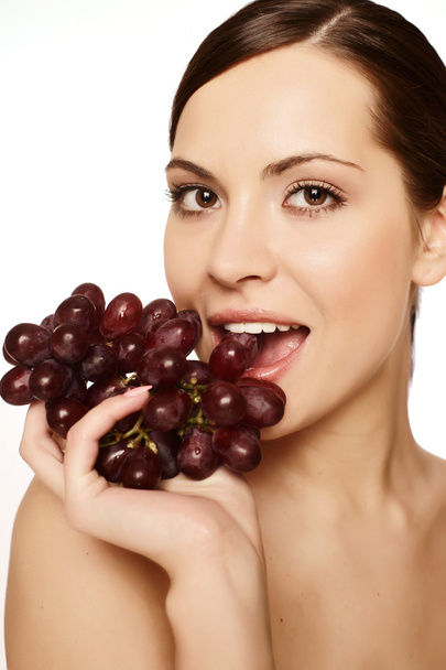 Beautiful young woman with grape - Foto, imagen