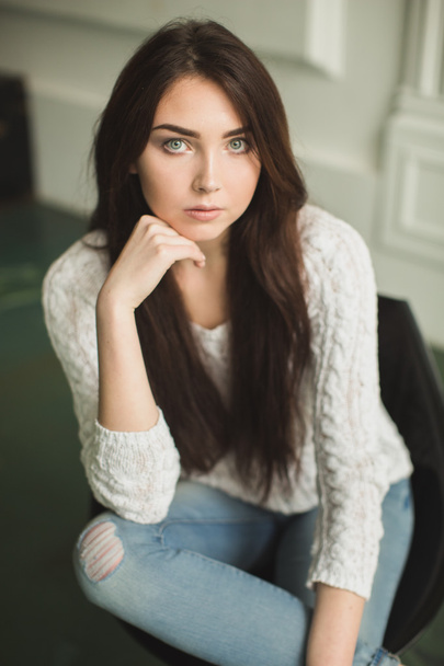 Portrait of a young lady in photostudio interior - Photo, image