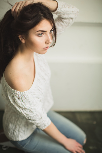 Portrait of a young lady in photostudio interior - Photo, Image