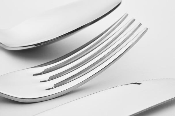 Knife fork spoon detail over a white background. Cutlery.  - Foto, afbeelding