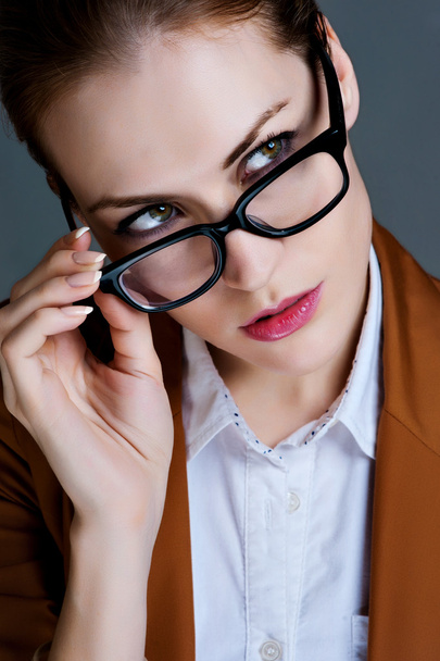 Beautiful business woman with glasses. Close-up portrait - 写真・画像