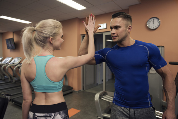 Couple training together at the gym - Photo, Image