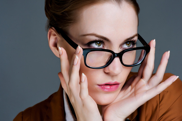 Beautiful business woman with glasses. Close-up portrait - Fotó, kép