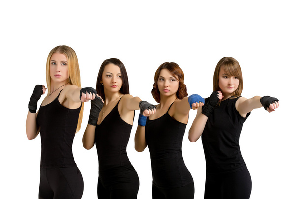 Group of women isolated at white making tae bo - Foto, afbeelding