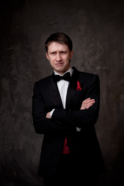 Funny young man wearing tuxedo - Fotografie, Obrázek