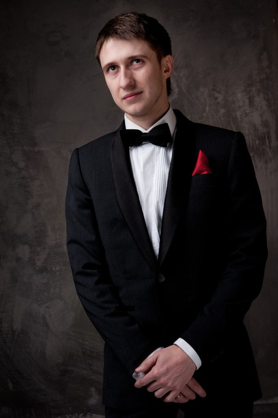 Funny young man wearing tuxedo - Photo, Image