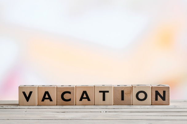 Vacation message made of wooden cubes - Photo, Image