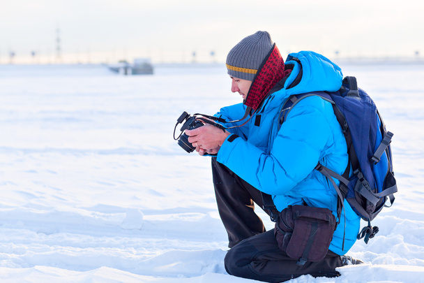 photographer in the winter landscape - Фото, изображение
