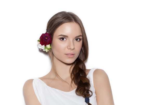 Beautiful woman with delicate flowers in hair - Fotografie, Obrázek