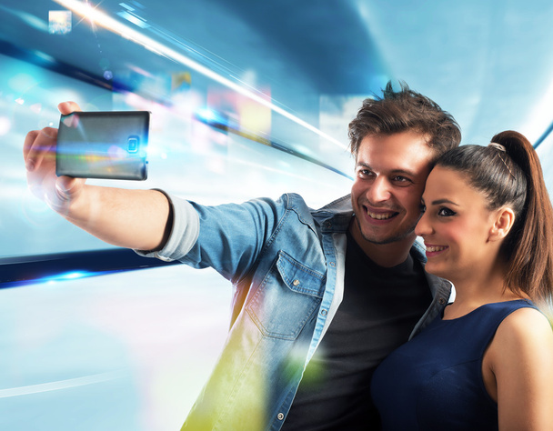 Smiling couple taking a selfie - Photo, Image