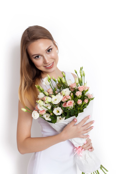 Young cute woman holding Bouquet of flowers - Fotoğraf, Görsel
