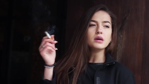 Beautiful Woman Smokes a Cigarette. - Materiał filmowy, wideo