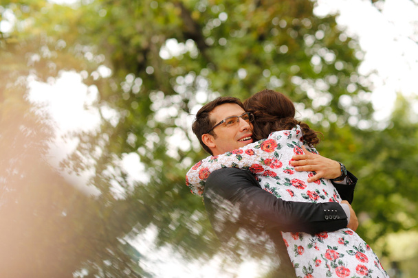 Joyful couple embracing outdoor - Photo, image