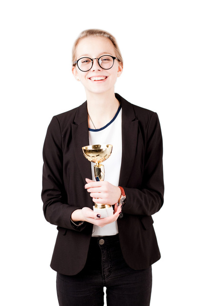Beautiful girl hold cup as winner of competition isolated - Foto, afbeelding
