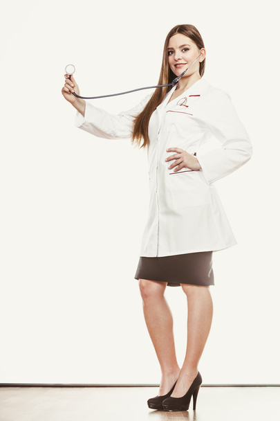 doctor with stethoscope wearing white coat - Фото, изображение