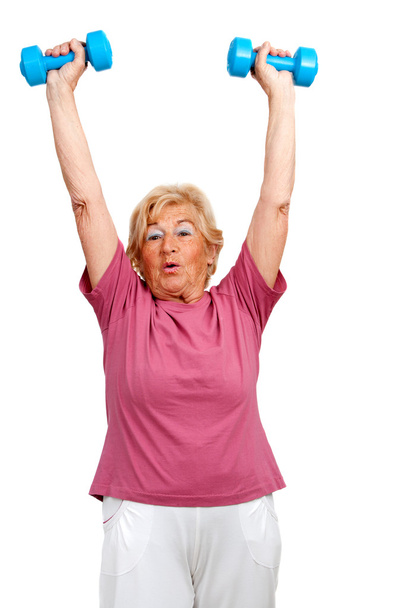 Donna anziana alzare le braccia con i pesi
. - Foto, immagini