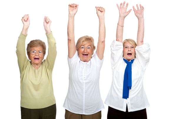 Three senior women raising hands. - Zdjęcie, obraz
