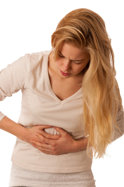 Sick woman with pain in the stomac or belly isolated over white  - Foto, Imagem