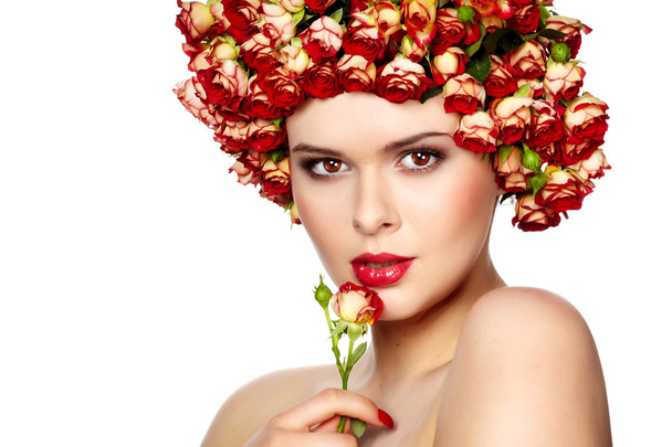 Portrait of young beautiful woman with roses in hair, on white b - Foto, immagini