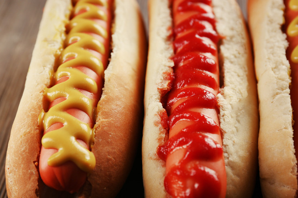 fresh hot dogs with sauce - Foto, afbeelding