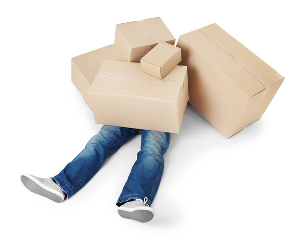 Man lying under pile of carton boxes - Foto, Bild