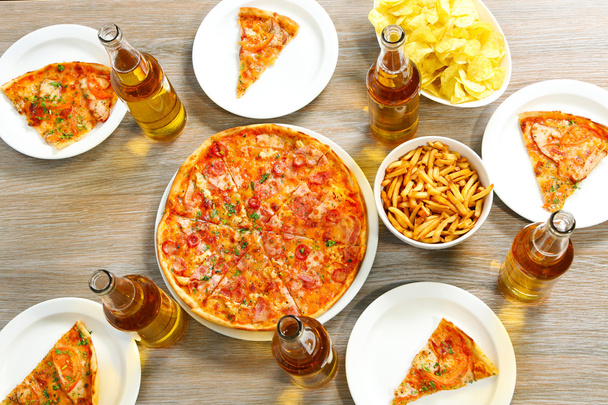 Table at home with pizza and drinks for friends - Фото, изображение