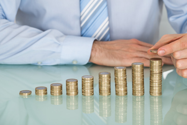 Businessman Making Stack Of Coins - Photo, Image