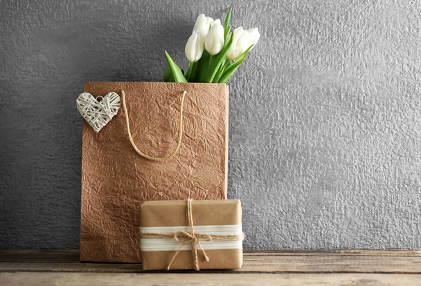 White tulips in paper bag - Фото, изображение