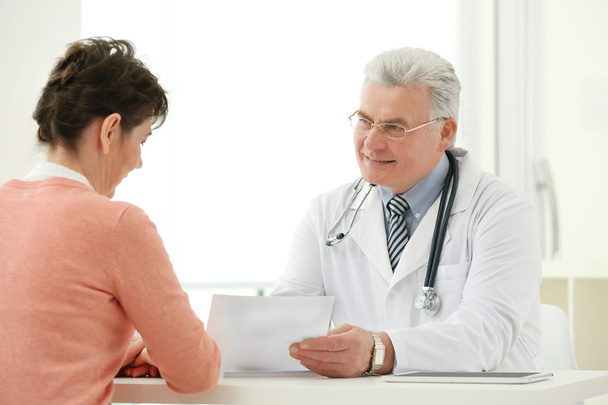 Doctor and patient in office - Photo, image