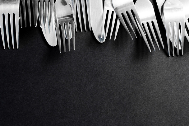 steel fork  on a black background - Φωτογραφία, εικόνα