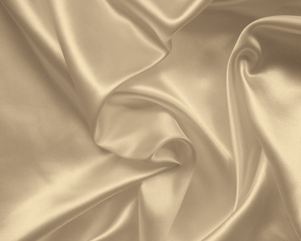 Smooth elegant golden silk or satin texture as background. In Se - 写真・画像