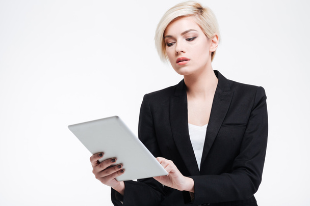 Charming businesswoman using tablet computer - Photo, image