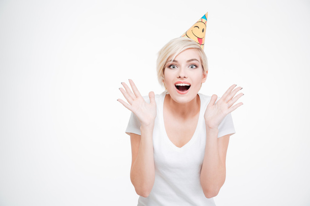Happy amazed woman in party hat looking at camera - Foto, Bild
