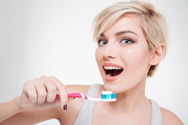 Happy cute woman brushing teeth - Foto, Imagem