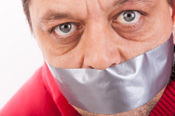 Man with tape gagged mouth - Photo, Image
