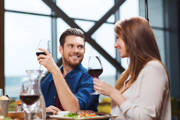 couple dining and drinking wine at restaurant - Fotoğraf, Görsel